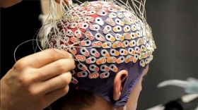 Mind Attention Interface being adjusted on someone's head